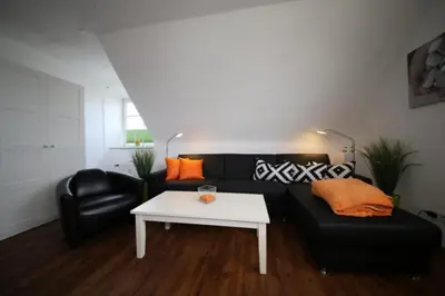 Ein Sitzbereich in der Unterkunft Ferienwohnung Kutter Haus Duckdalben