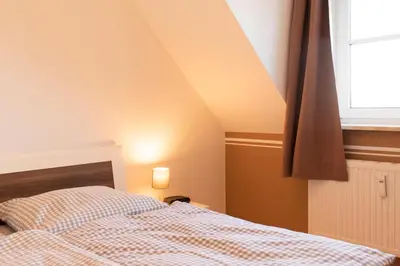 Ein Bett oder Betten in einem Zimmer der Unterkunft Ferienwohnung MehrBlick 33