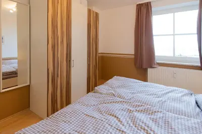Ein Bett oder Betten in einem Zimmer der Unterkunft Ferienwohnung MehrBlick 21
