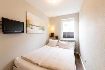 Ein Bett oder Betten in einem Zimmer der Unterkunft Ferienwohnung Oskar