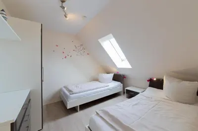 Ein Bett oder Betten in einem Zimmer der Unterkunft Ferienwohnung Küstenliebe