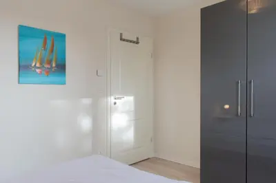 Ein Bett oder Betten in einem Zimmer der Unterkunft Ferienwohnung Küstenliebe