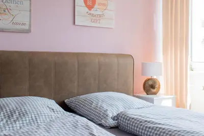 Ein Bett oder Betten in einem Zimmer der Unterkunft Ferienwohnung Ostseestübchen