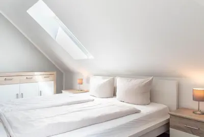 Ein Bett oder Betten in einem Zimmer der Unterkunft Ferienwohnung Ocean Drive