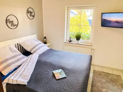 Ein Bett oder Betten in einem Zimmer der Unterkunft Ferienwohnung Gorch Fock Park Appartement 16