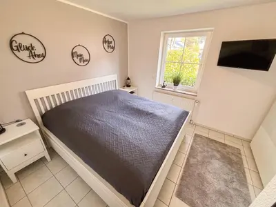 Ein Bett oder Betten in einem Zimmer der Unterkunft Ferienwohnung Gorch Fock Park Appartement 16