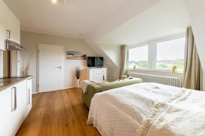 Ein Bett oder Betten in einem Zimmer der Unterkunft Ferienwohnung Ocean Lodge 3