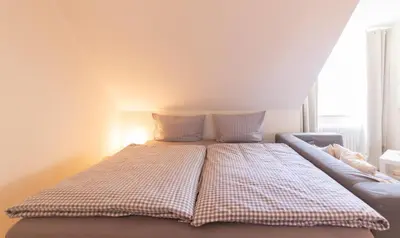 Ein Bett oder Betten in einem Zimmer der Unterkunft Ferienwohnung Ocean Lodge 4