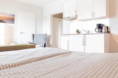 Ein Bett oder Betten in einem Zimmer der Unterkunft Ferienwohnung Ocean Lodge 4
