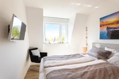 Ein Bett oder Betten in einem Zimmer der Unterkunft Ferienwohnung Windjammer