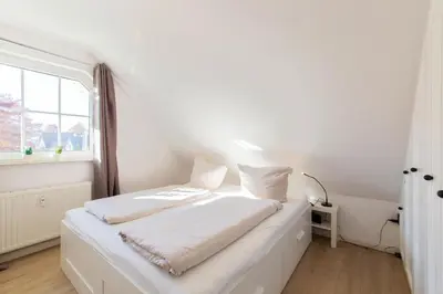 Ein Bett oder Betten in einem Zimmer der Unterkunft Ferienwohnung Ostseerauschen