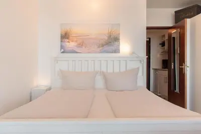 Ein Bett oder Betten in einem Zimmer der Unterkunft Ferienwohnung Ostseeblick