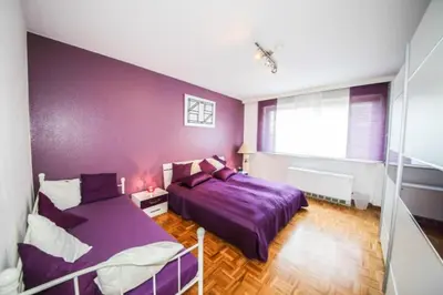 Ein Bett oder Betten in einem Zimmer der Unterkunft Ferienwohnung Sandburg