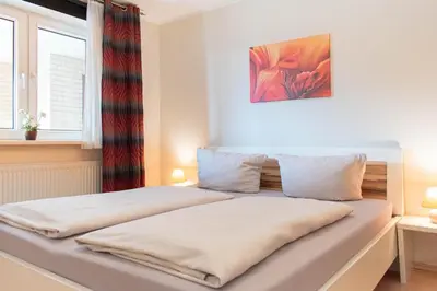 Ein Bett oder Betten in einem Zimmer der Unterkunft Ferienwohnung Seebrücke 04
