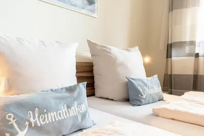 Ein Bett oder Betten in einem Zimmer der Unterkunft Ferienwohnung Seebrücke 08