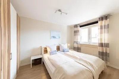 Ein Bett oder Betten in einem Zimmer der Unterkunft Ferienwohnung Seebrücke 08