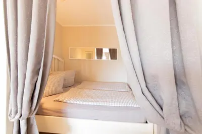 Ein Bett oder Betten in einem Zimmer der Unterkunft Ferienwohnung Seetempel App. 35