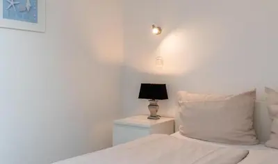 Ein Bett oder Betten in einem Zimmer der Unterkunft Ferienwohnung Sommerwind