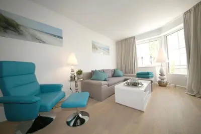 Ein Sitzbereich in der Unterkunft Ferienwohnung Strandallee 200