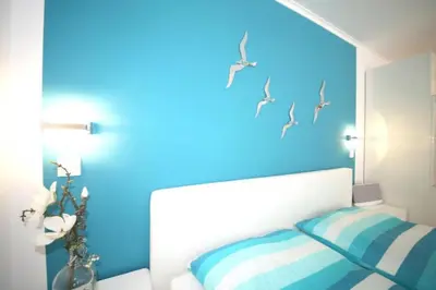 Ein Bett oder Betten in einem Zimmer der Unterkunft Ferienwohnung Strandallee 200