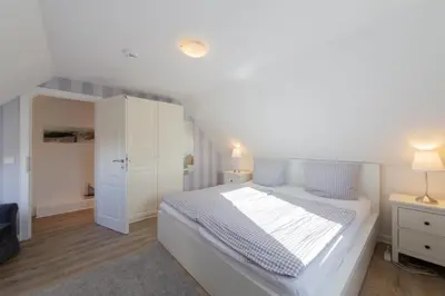 Ein Bett oder Betten in einem Zimmer der Unterkunft Ferienwohnung Strandaster