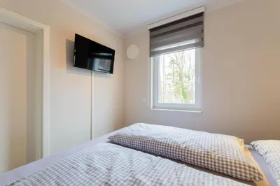Ein Bett oder Betten in einem Zimmer der Unterkunft Ferienwohnung Strandgras