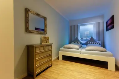 Ein Bett oder Betten in einem Zimmer der Unterkunft Ferienwohnung Strandhaus Möwenberg App.12