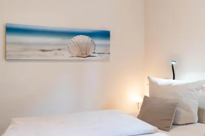 Ein Bett oder Betten in einem Zimmer der Unterkunft Ferienwohnung Strandmuschel