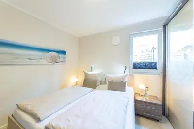 Ein Bett oder Betten in einem Zimmer der Unterkunft Ferienwohnung Strandmuschel