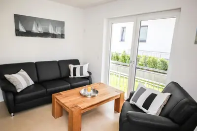 Ein Sitzbereich in der Unterkunft Ferienwohnung Strandhaus Möwenberg App. 77