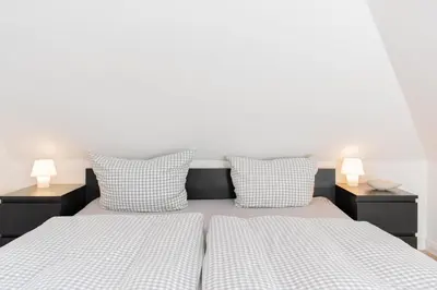 Ein Bett oder Betten in einem Zimmer der Unterkunft Ferienwohnung Strandnah