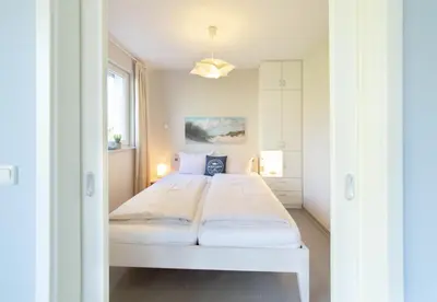 Ein Bett oder Betten in einem Zimmer der Unterkunft Ferienwohnung Strandläufer