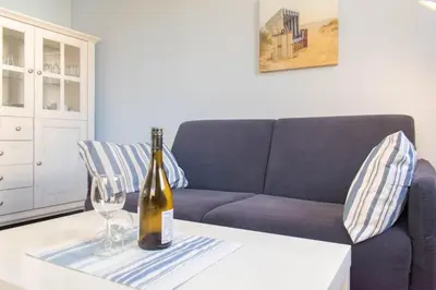 Ein Sitzbereich in der Unterkunft Ferienwohnung Strandläufer