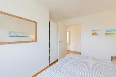 Ein Bett oder Betten in einem Zimmer der Unterkunft Ferienwohnung Stranddüne B 10