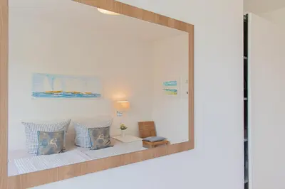 Ein Bett oder Betten in einem Zimmer der Unterkunft Ferienwohnung Stranddüne B 10