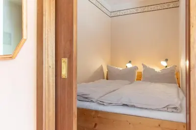 Ein Bett oder Betten in einem Zimmer der Unterkunft Ferienwohnung Strandhotel