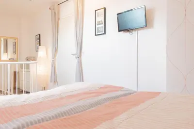Ein Bett oder Betten in einem Zimmer der Unterkunft Ferienwohnung Residenz Barke App. 20