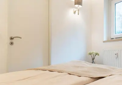 Ein Bett oder Betten in einem Zimmer der Unterkunft Ferienwohnung Seeblick