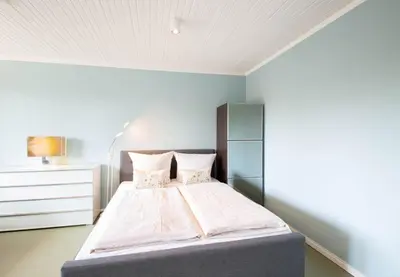 Ein Bett oder Betten in einem Zimmer der Unterkunft Ferienwohnung Strandzwerg
