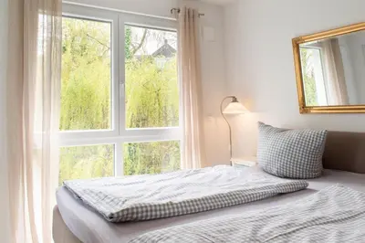 Ein Bett oder Betten in einem Zimmer der Unterkunft Ferienwohnung Strandvilla Augustusbad 14