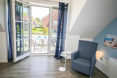 Ein Sitzbereich in der Unterkunft Ferienwohnung Strandliebe