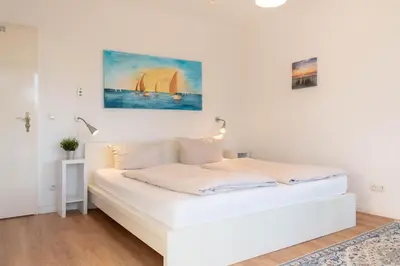 Ein Bett oder Betten in einem Zimmer der Unterkunft Ferienwohnung Villa Miramare