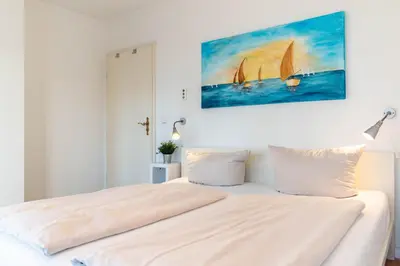 Ein Bett oder Betten in einem Zimmer der Unterkunft Ferienwohnung Villa Miramare