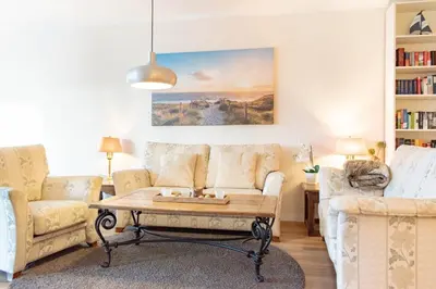 Ein Sitzbereich in der Unterkunft Ferienwohnung Villa Miramare