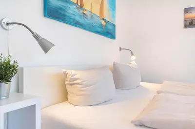 Ein Bett oder Betten in einem Zimmer der Unterkunft Ferienwohnung Villa Miramare