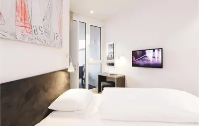 Ein Bett oder Betten in einem Zimmer der Unterkunft Highend Travemünde - Whg 302