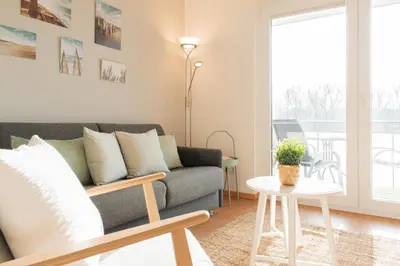 Ein Sitzbereich in der Unterkunft Ferienwohnung Stranddüne B 13