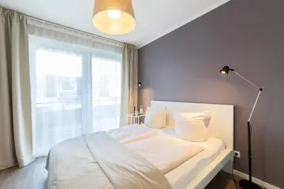 Ein Bett oder Betten in einem Zimmer der Unterkunft Ferienwohnung Stranderlebnis
