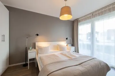 Ein Bett oder Betten in einem Zimmer der Unterkunft Ferienwohnung Stranderlebnis