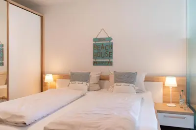 Ein Bett oder Betten in einem Zimmer der Unterkunft Ferienwohnung Sunshine Beachhouse 111